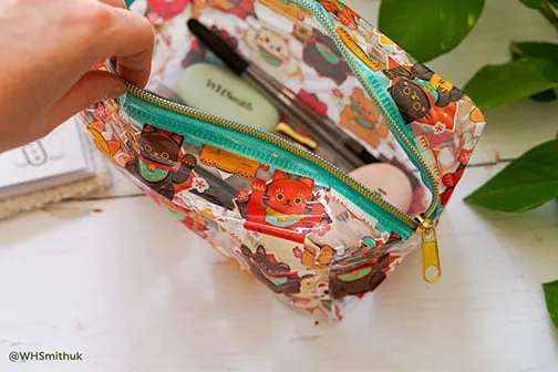 WH Smith Transparent Stationary bag with animals printed on.