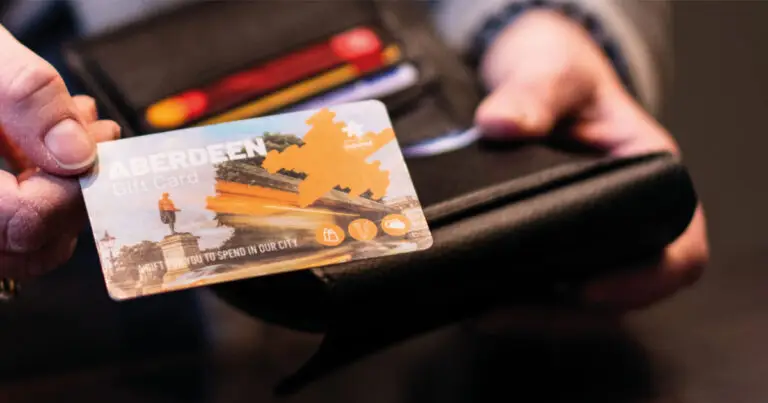 Person holding Aberdeen Gift Card