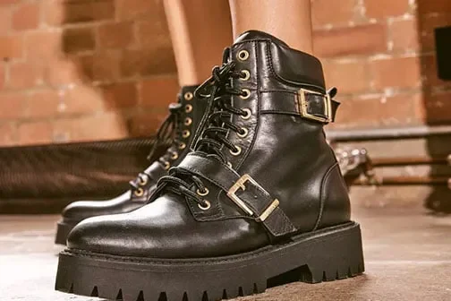 Woman wearing office black boots